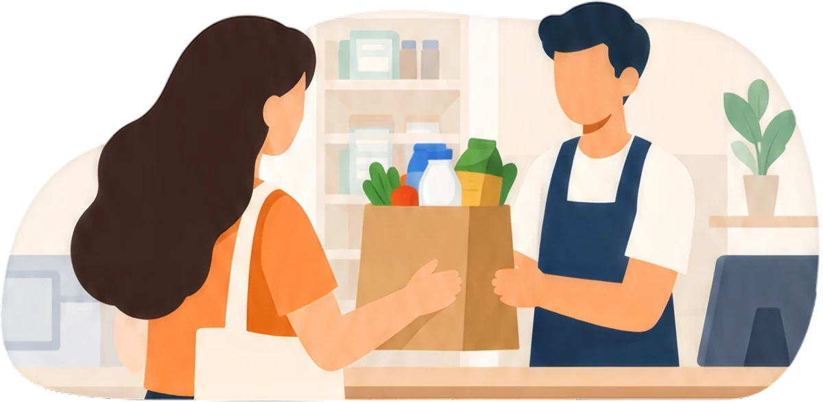 A shopkeeper handing a bag of groceries to a customer